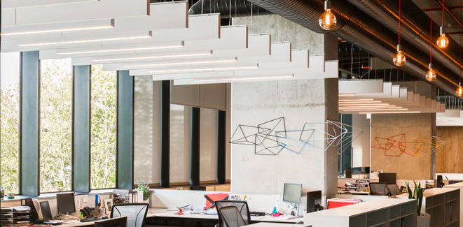 Ceiling mounted acoustic baffles in an open office.