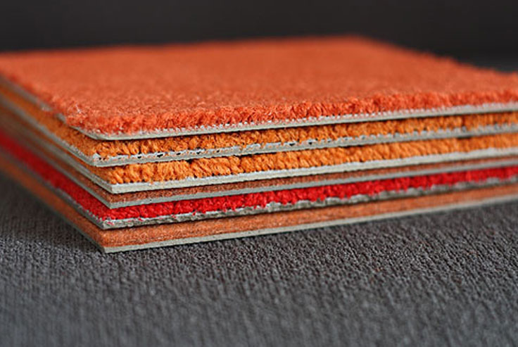 A side profile/cut through of acoustic office carpet designed for noise reduction
